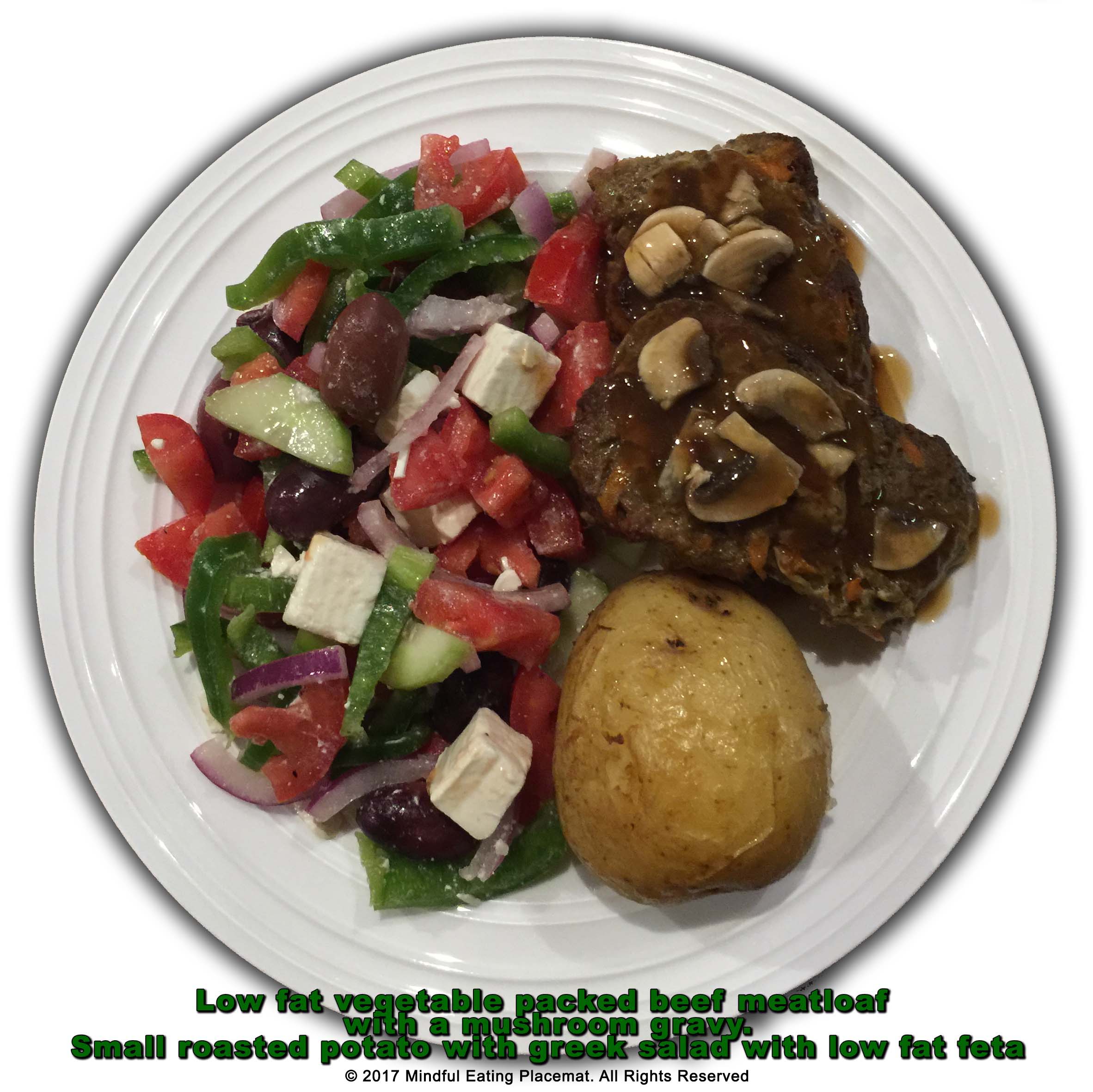 Beef meatloaf with a potato and greek salad