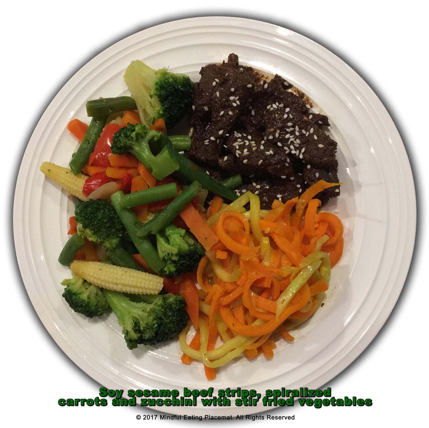 Sesame beef with spiralized carrots and zucchini and stir-fry vegetables