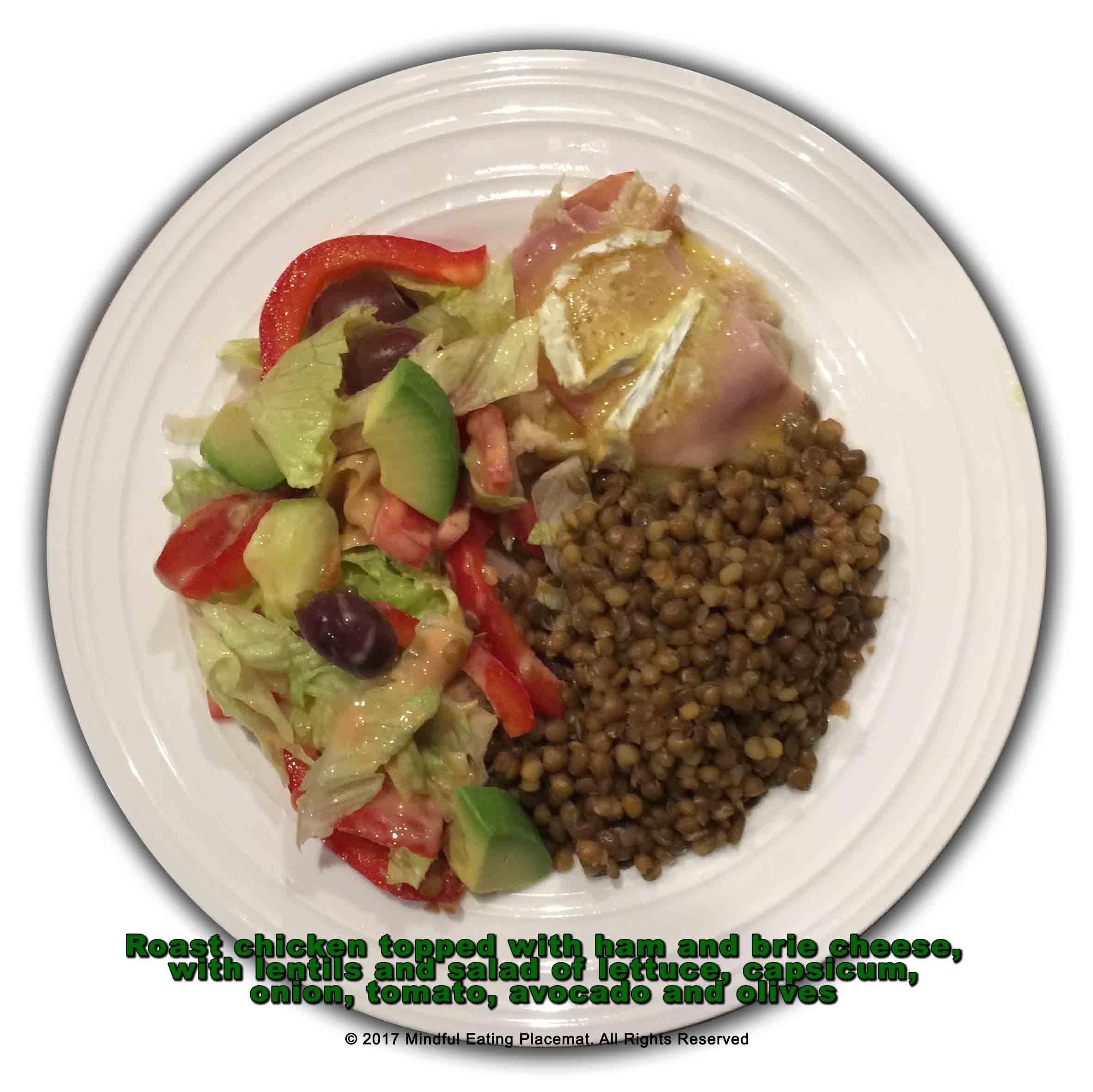 Chicken topped with ham and brie, with lentils and a salad
