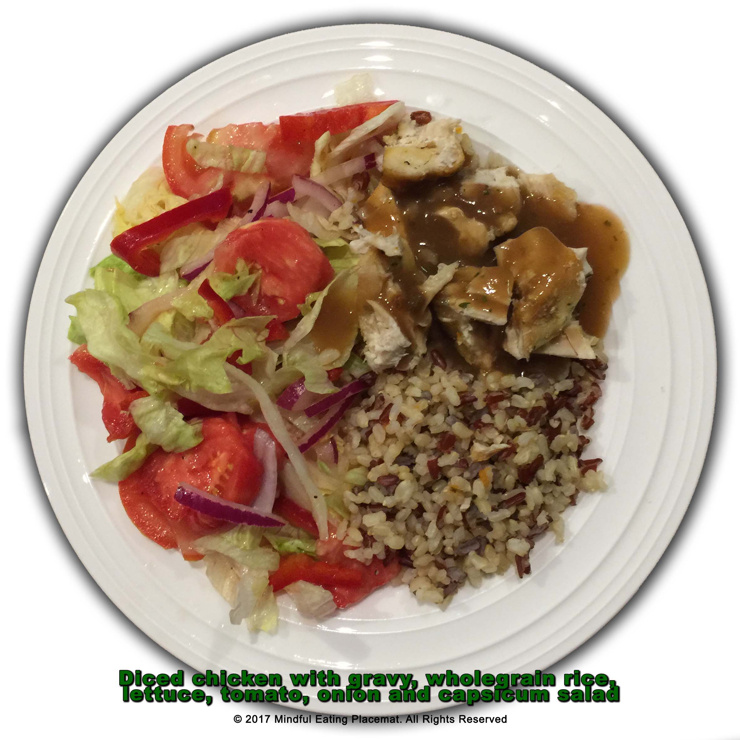 Diced chicken with gravy and wholegrain rice with a lettuce and tomato salad