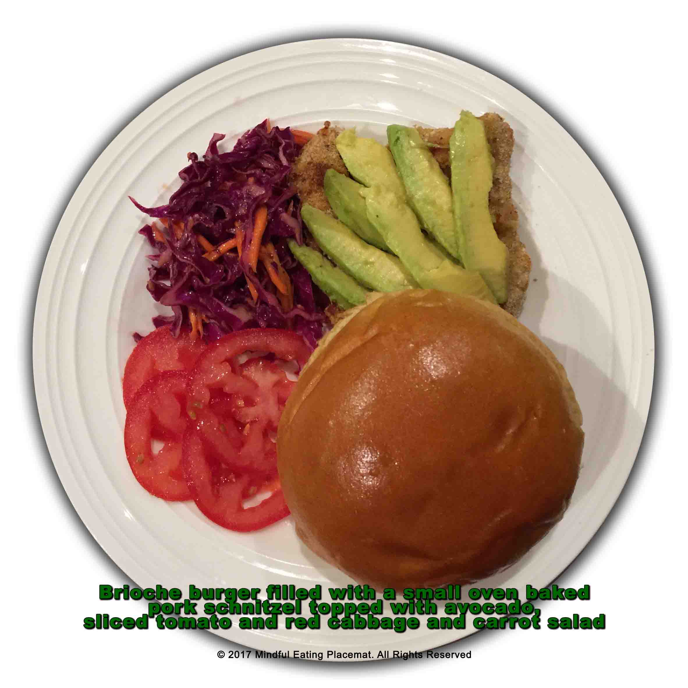 Pork burger with avocado, tomato and red cabbage salad 