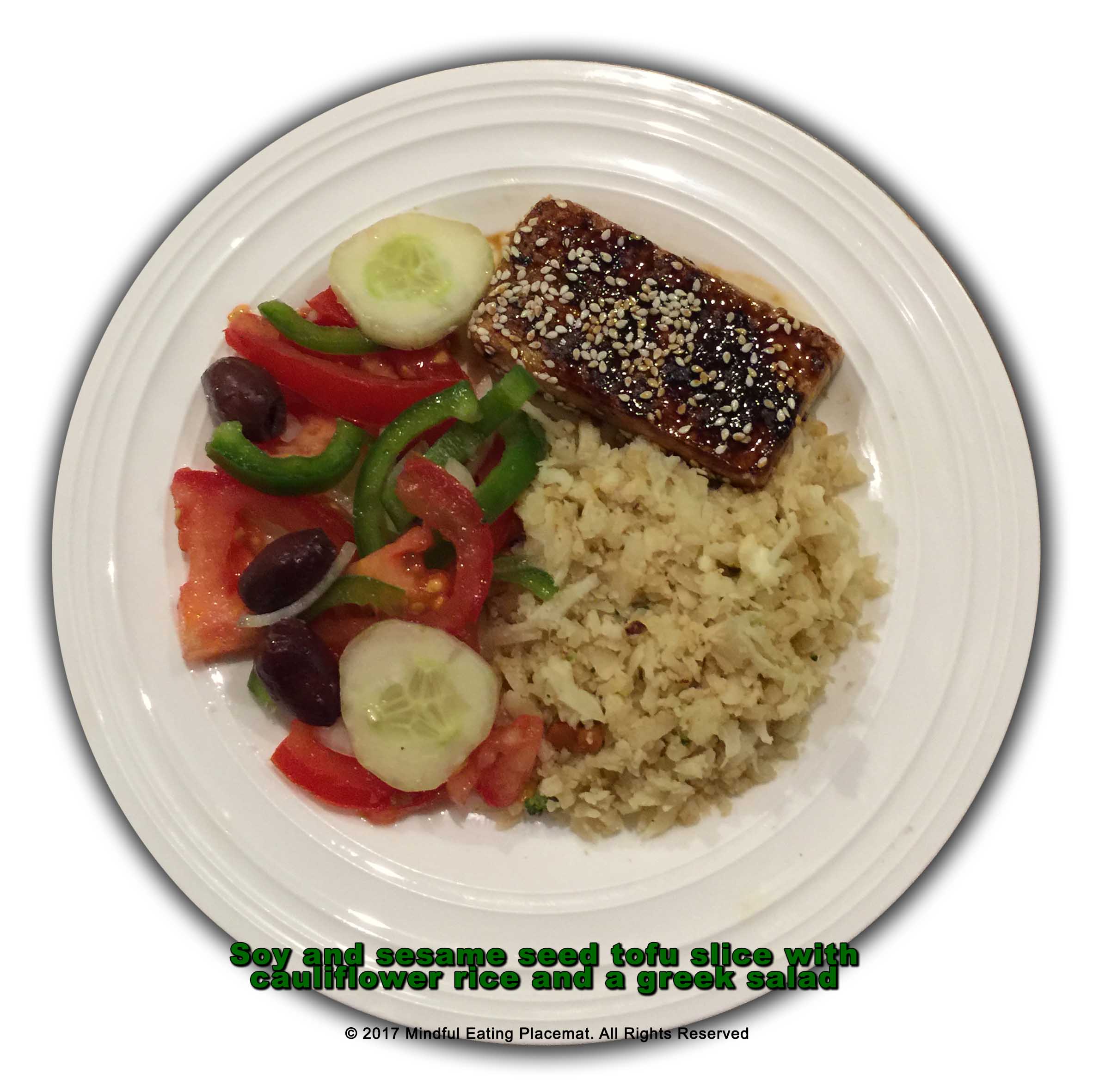 Soy and sesame seed tofu slice with cauliflower rice and a greek salad