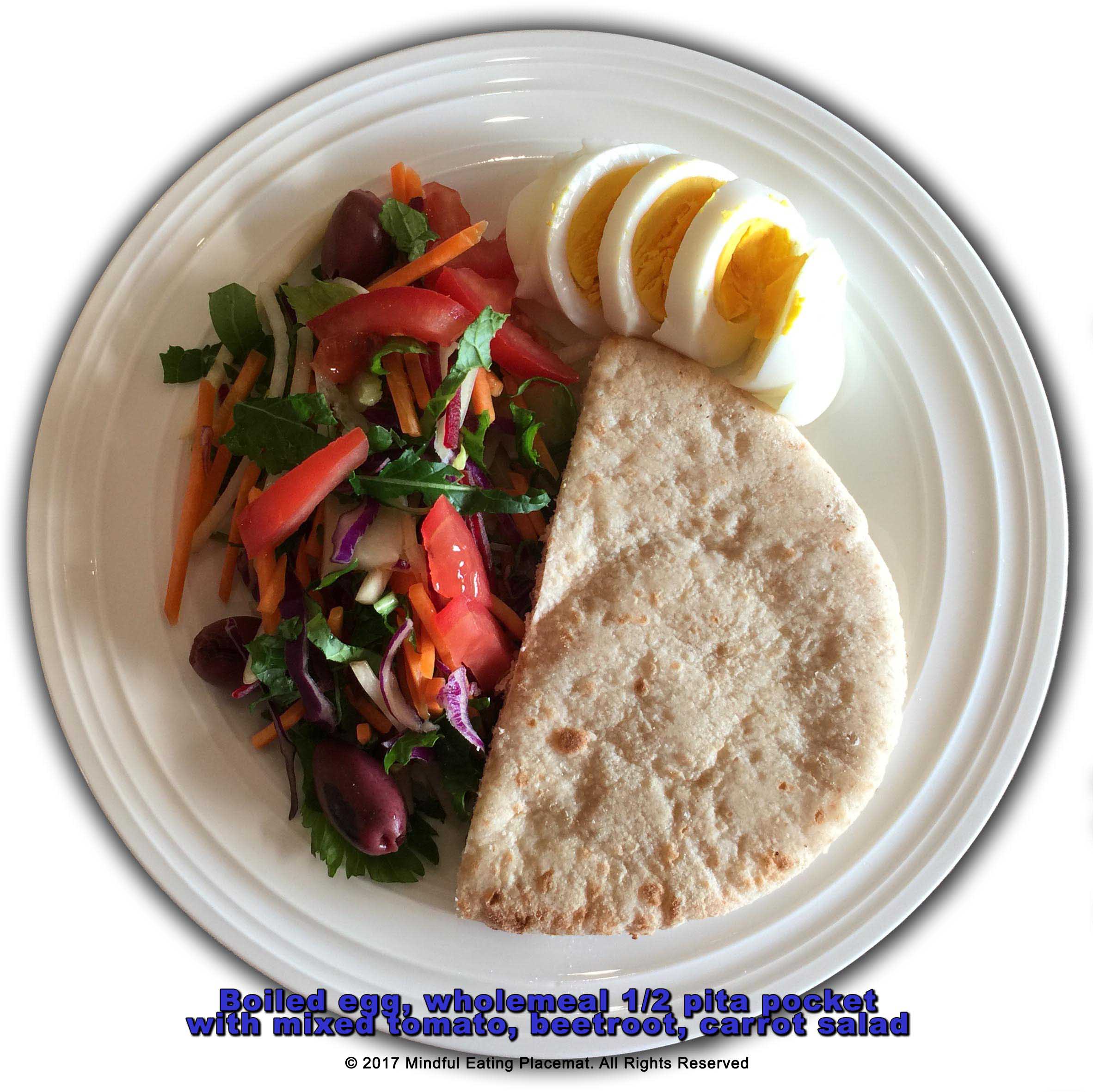Boiled egg with half a wholemeal pita pocket with tomato, beetroot, carrot salad