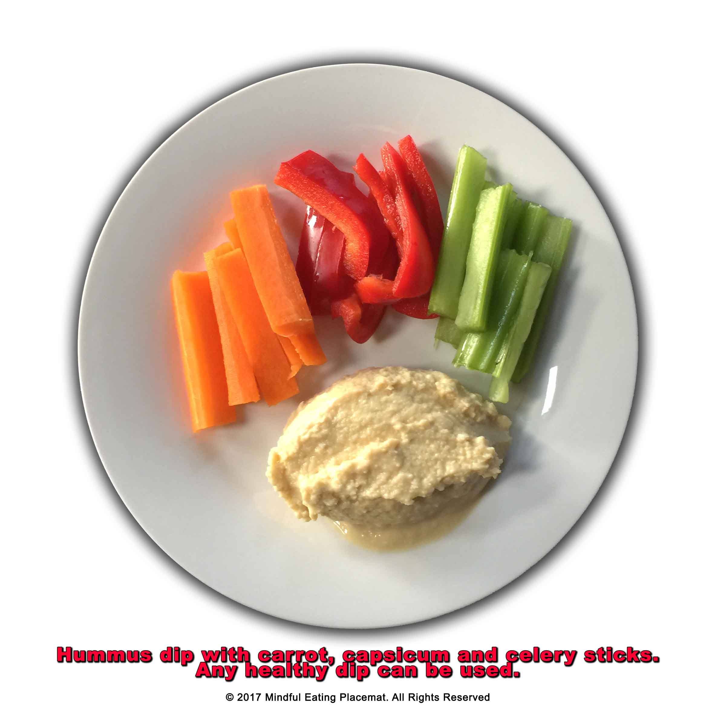 Sliced carrot, and celery with hummus dip